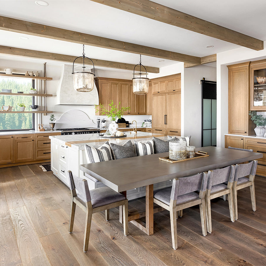 Photo of kitchen with wood flooring and naturally finished wood cabinets.